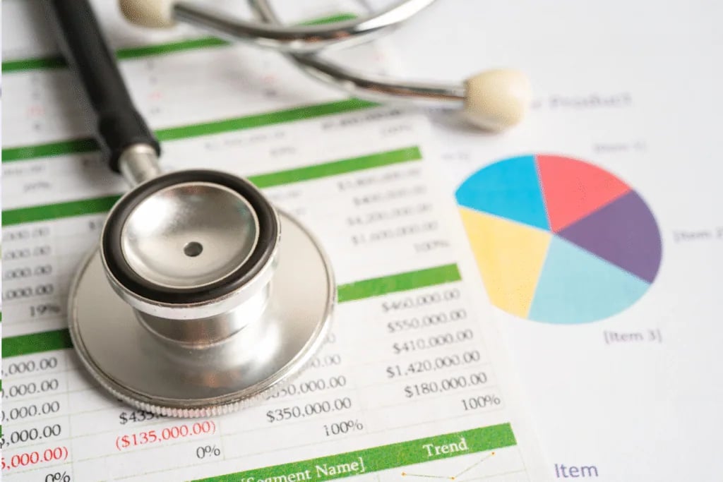 Hospice billing specialist reviewing NOE deadlines and Medicare hospice claim errors