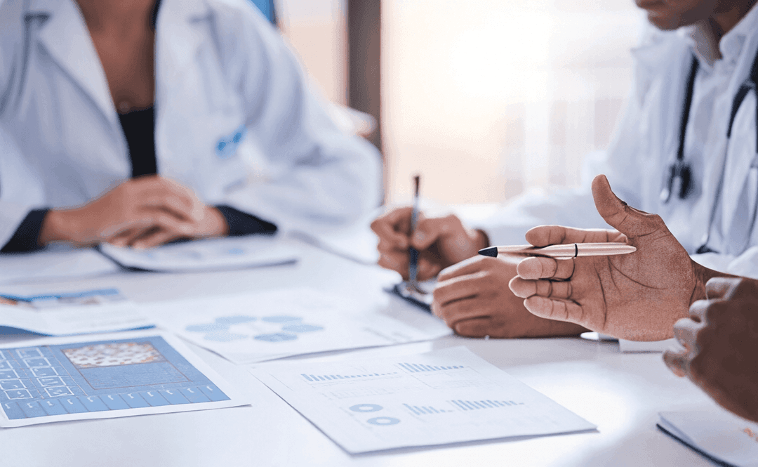 Doctor teaching or discussing clinic software charts with team